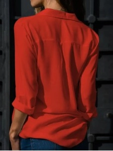 Women's solid color long sleeved button up shirt