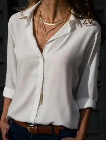 Women's solid color long sleeved button up shirt