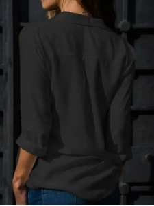 Women's solid color long sleeved button up shirt